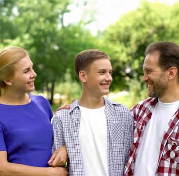 image of a student walking with parents